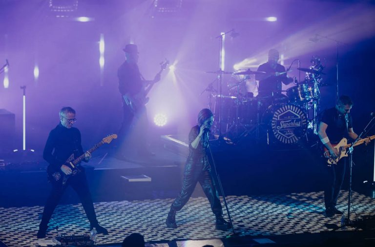 The French rock band Superbus onstage with the Gravity Glow Stands.