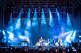Cameo OPUS X4 profile moving heads in action during a Bryan Adams concert – producing crisp blue beams from the truss, highlighting their precise output and stage presence.